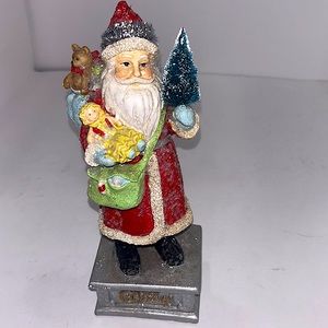 Antique ceramic Santa figure 10-12” tall with snow and sparkles holding gifts